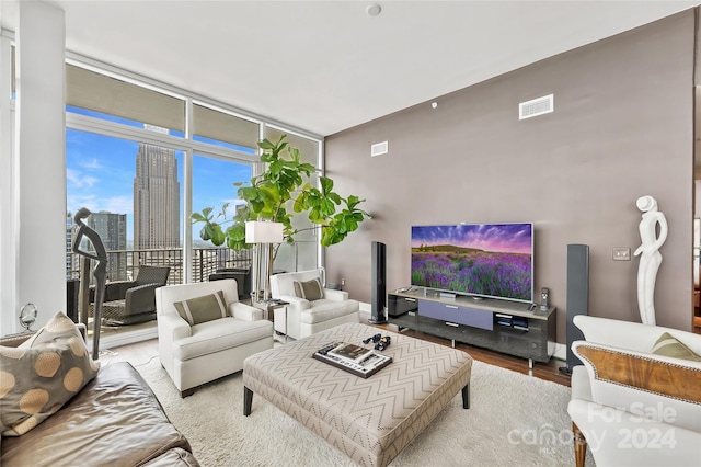 215 N Pine St Unit 3705, Charlotte, NC 28202 - living room featuring wood finished floors and a wall of windows