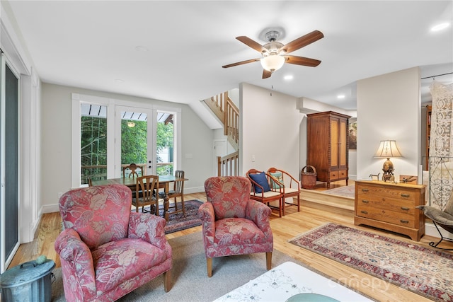 sitting room with ceiling fan and light hardwood / wood-style floors