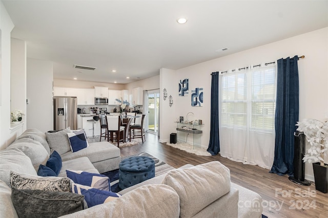 living room featuring plenty of natural light and hardwood / wood-style floors