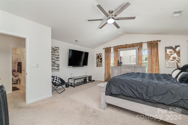 bedroom with ceiling fan, light carpet, and vaulted ceiling