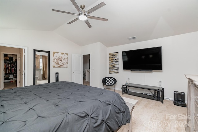 carpeted bedroom featuring lofted ceiling and ceiling fan