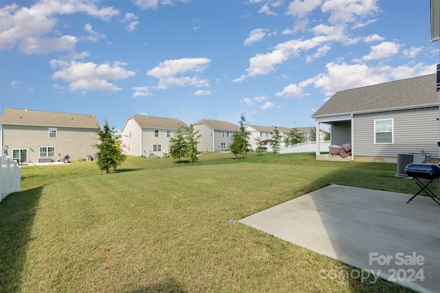 view of yard featuring a patio and cooling unit