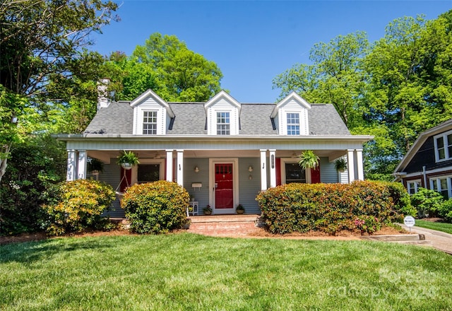 cape cod-style house with a porch and a front yard