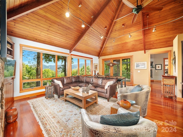 living room featuring light hardwood / wood-style flooring, high vaulted ceiling, and wooden ceiling