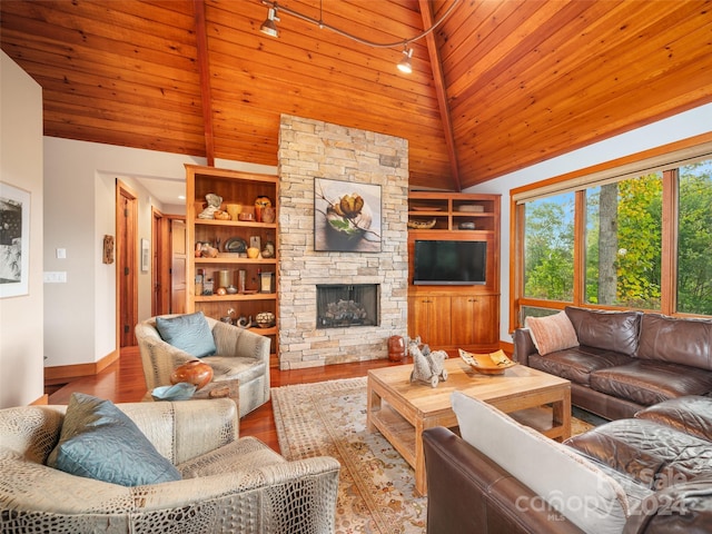 living room with light wood-type flooring, a fireplace, rail lighting, high vaulted ceiling, and wooden ceiling