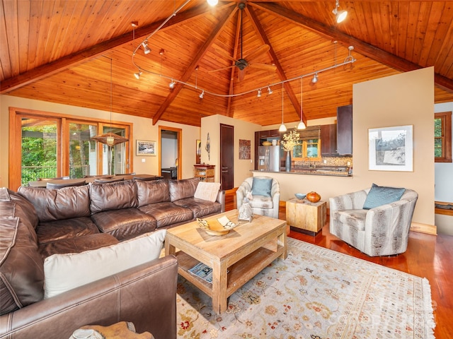 living room with wood ceiling, beam ceiling, track lighting, and hardwood / wood-style floors