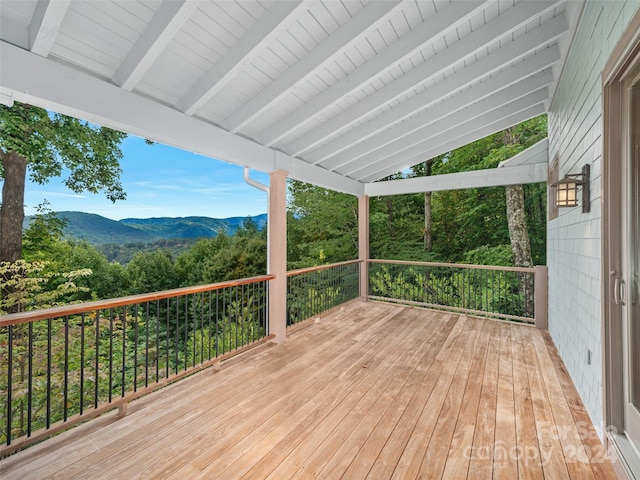 wooden deck with a mountain view