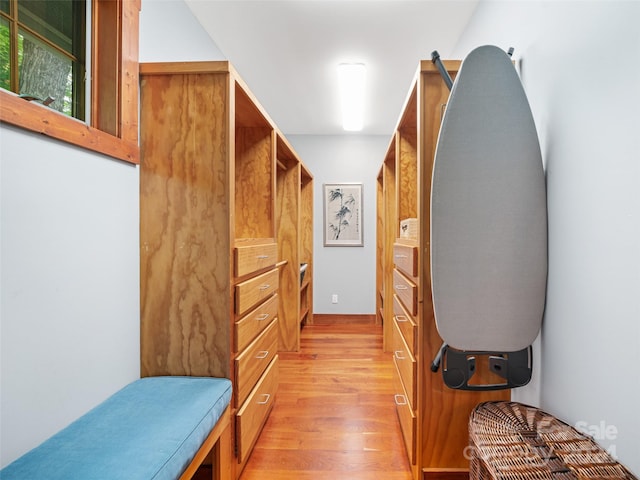 spacious closet with light hardwood / wood-style flooring