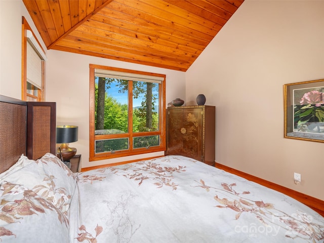 bedroom with vaulted ceiling and wooden ceiling