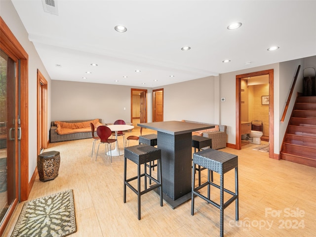 dining space featuring light wood-type flooring