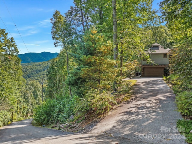 exterior space with a mountain view and a garage