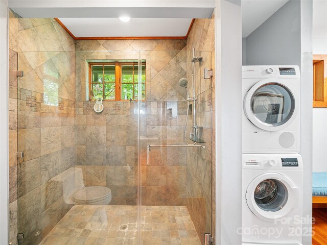 393 Deer Trail Dr, Burnsville, NC 28714 - full bathroom with a stall shower and stacked washer and dryer