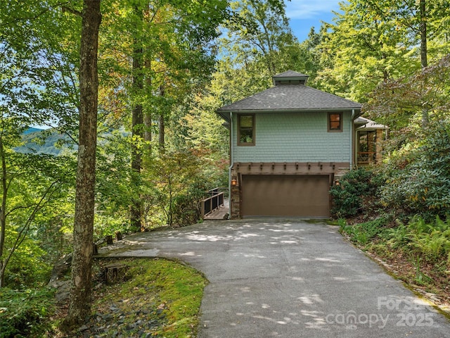 393 Deer Trail Dr, Burnsville, NC 28714 - exterior space featuring a garage, driveway, and a forest view