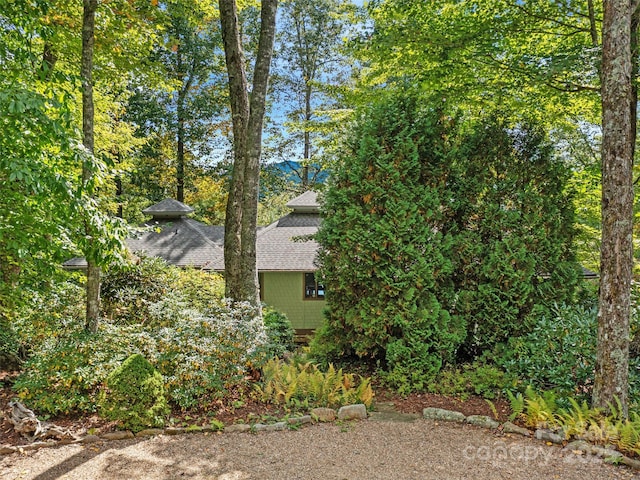 393 Deer Trail Dr, Burnsville, NC 28714 - view of side of property with a shingled roof