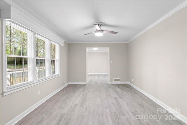 unfurnished room featuring light wood-type flooring, ceiling fan, and crown molding