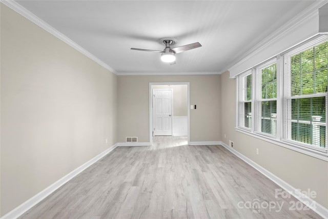 spare room featuring ceiling fan, light hardwood / wood-style flooring, and crown molding