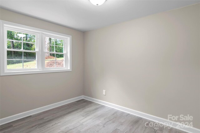 empty room with light hardwood / wood-style floors