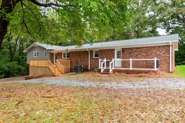 ranch-style house with central AC unit