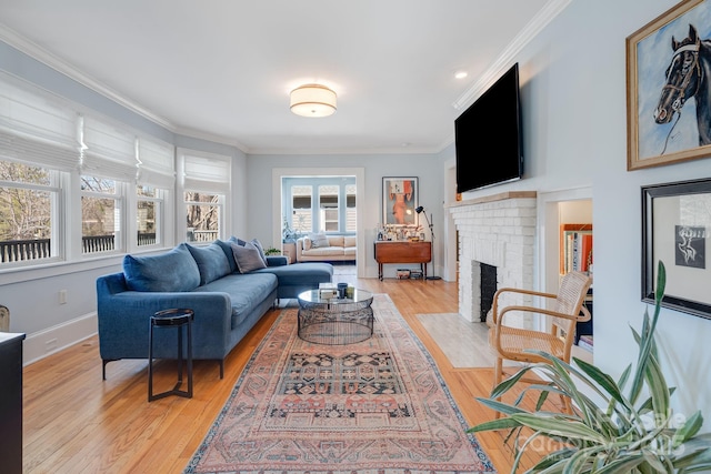 22 Kenilwood Pl, Asheville, NC 28803 - living area with ornamental molding, light wood finished floors, baseboards, and a brick fireplace