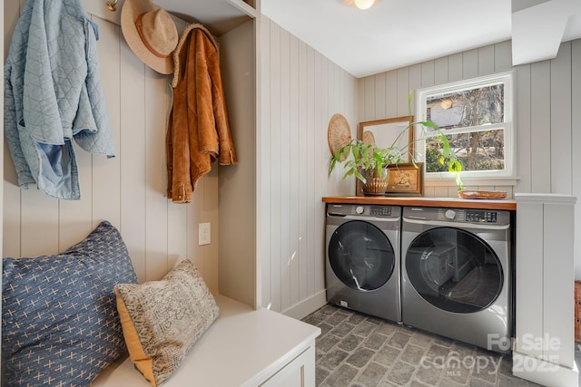 22 Kenilwood Pl, Asheville, NC 28803 - laundry area featuring washer and clothes dryer, brick floors, baseboards, and wood walls