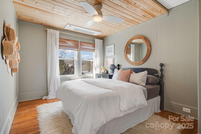 22 Kenilwood Pl, Asheville, NC 28803 - bedroom featuring wooden ceiling, wood finished floors, baseboards, and ceiling fan