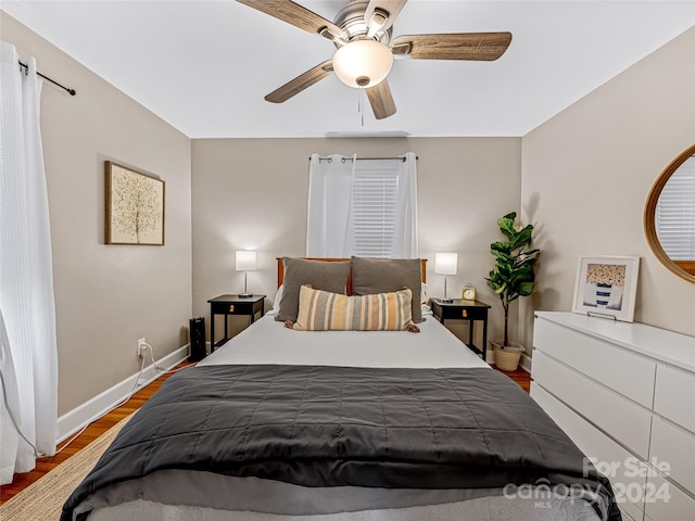 bedroom featuring hardwood / wood-style flooring and ceiling fan