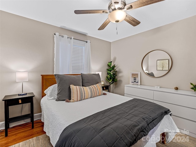 bedroom featuring wood-type flooring and ceiling fan