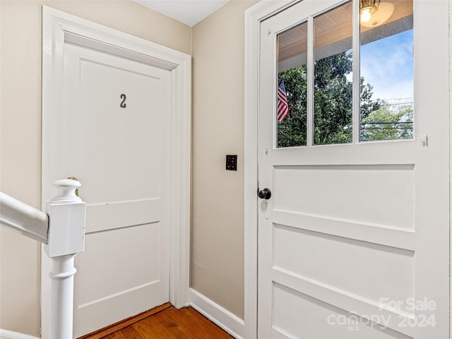 doorway to outside featuring wood-type flooring