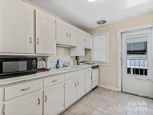 kitchen with sink, white range with electric cooktop, and white cabinets