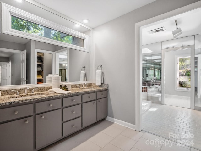 bathroom featuring tile patterned floors and vanity