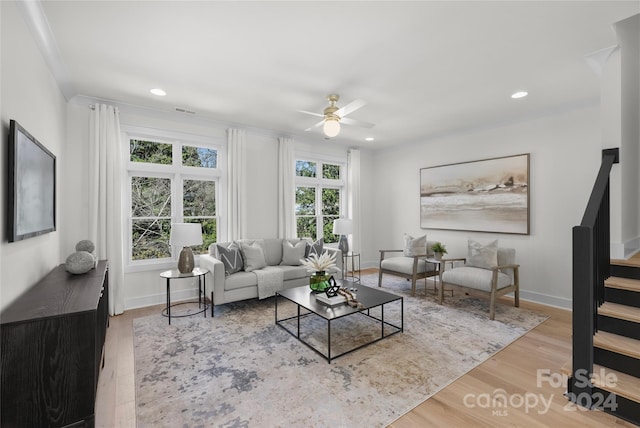 living room featuring ceiling fan and light wood-type flooring