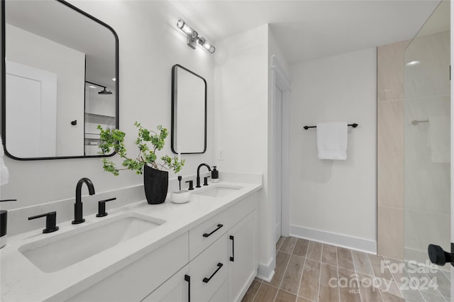 3109 Colyer Pl, Charlotte, NC 28205 - bathroom with walk in shower, wood finished floors, a sink, and double vanity