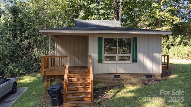 view of outbuilding with a lawn