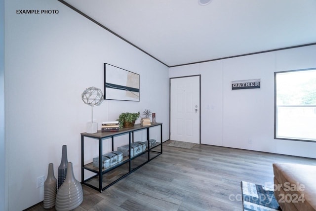 interior space featuring ornamental molding and hardwood / wood-style flooring