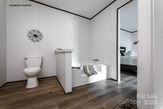 bathroom featuring wood-type flooring and toilet