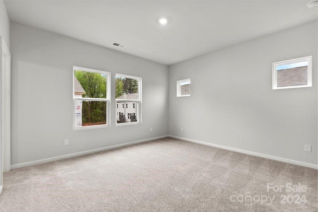 unfurnished room featuring carpet flooring