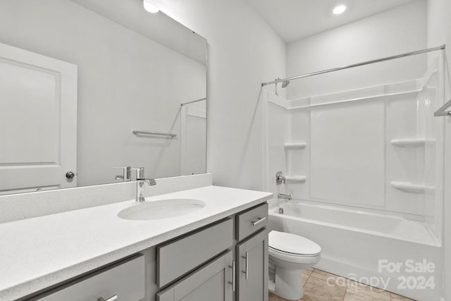 full bathroom with tile patterned floors,  shower combination, vanity, and toilet