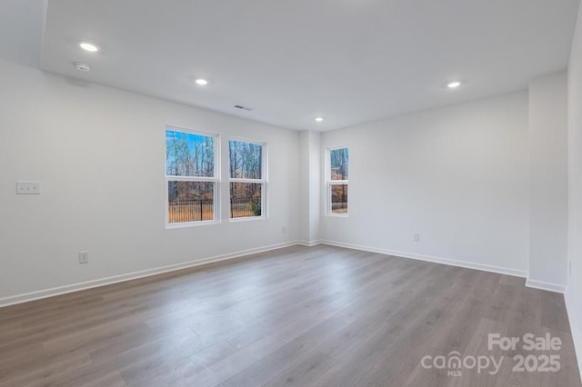 spare room featuring light hardwood / wood-style floors