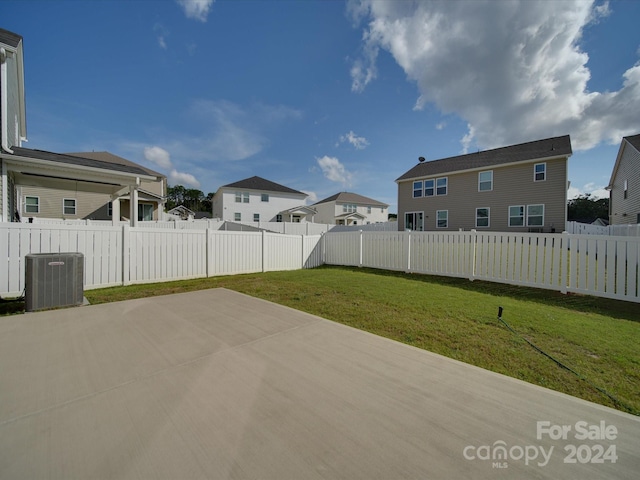 exterior space with central AC unit and a patio area