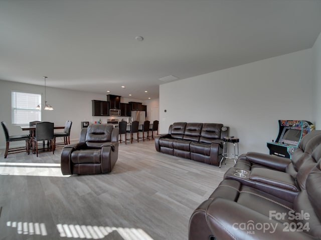 living room with light hardwood / wood-style floors