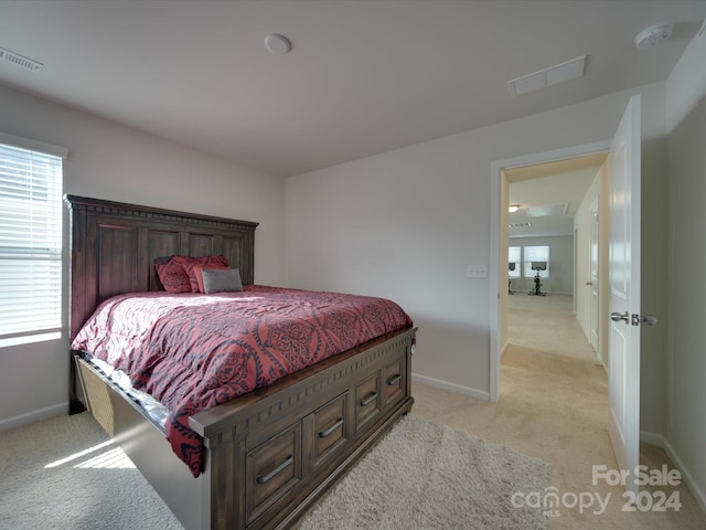 bedroom with light carpet