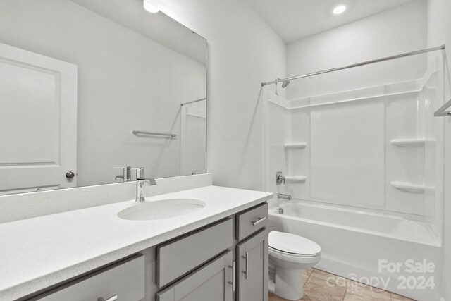 full bathroom with bathing tub / shower combination, vanity, toilet, and tile patterned floors