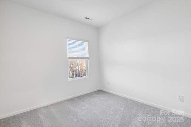 unfurnished room with carpet floors