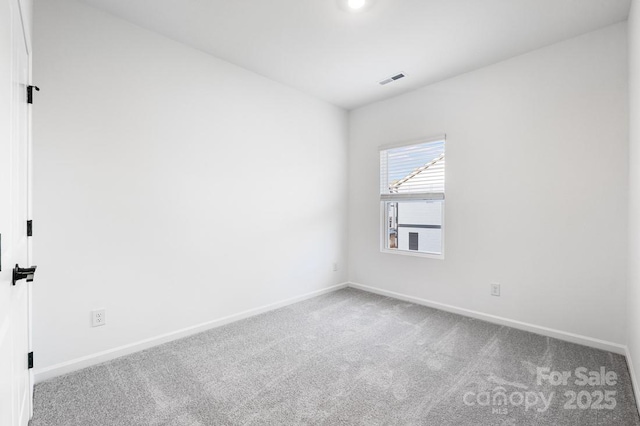 unfurnished room featuring carpet