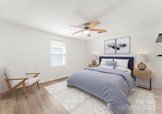 bedroom featuring light hardwood / wood-style floors and ceiling fan