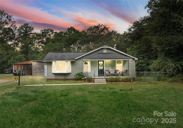 view of front of home featuring a yard and covered porch