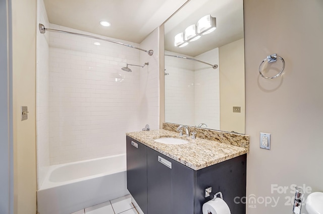 full bathroom with tile patterned floors, tiled shower / bath combo, vanity, and toilet