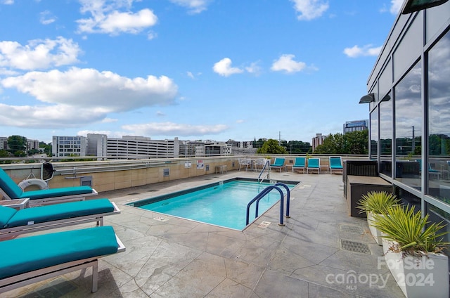 view of pool featuring a patio