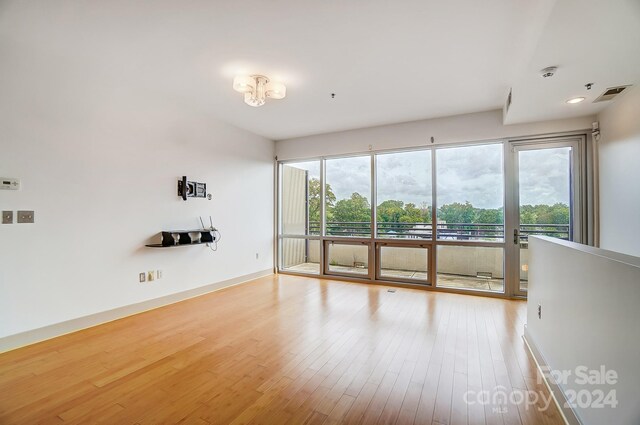 empty room featuring wood-type flooring