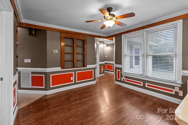 unfurnished room featuring ornamental molding, ceiling fan, and dark hardwood / wood-style flooring